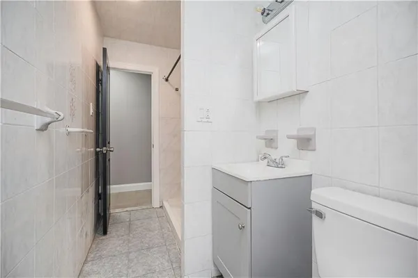 a utility room with cabinets washer and dryer