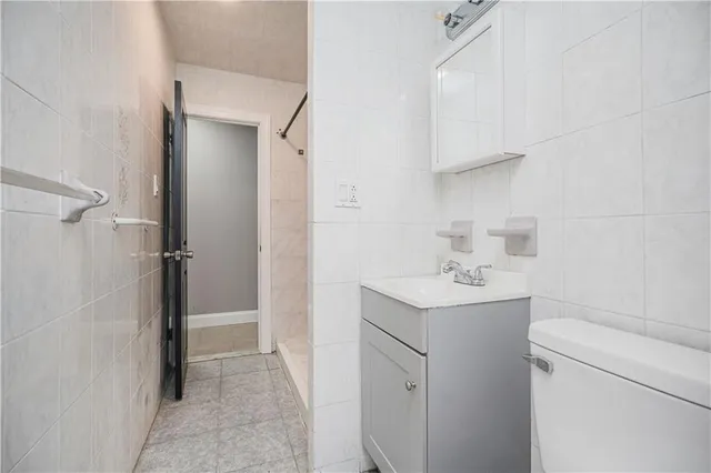 a utility room with cabinets washer and dryer