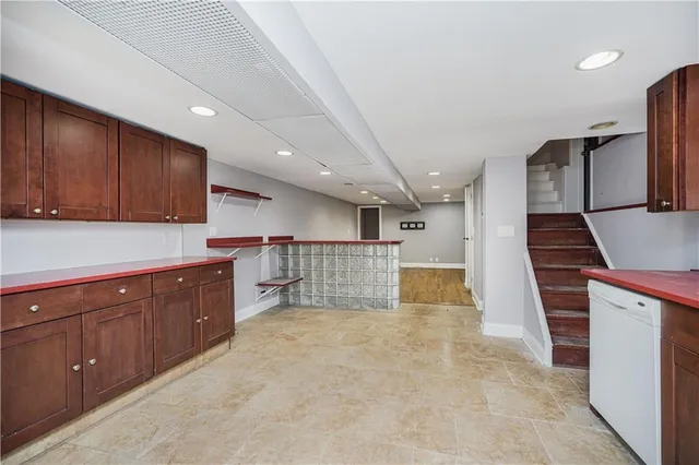 a kitchen with stainless steel appliances granite countertop a sink and cabinets