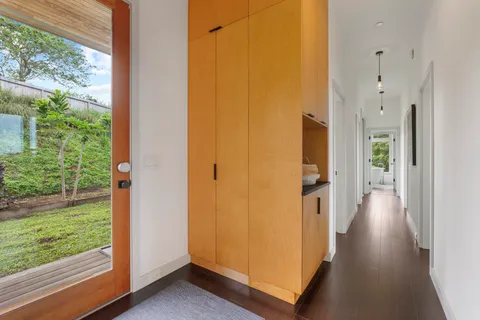 a view of a hallway with washer and dryer