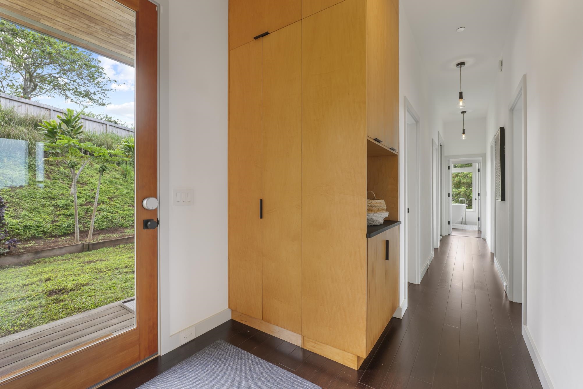 3127 Ua Noe Place, Unit B Haiku, HI 96708 - Photo 33 of 50 a view of a hallway with wooden floor and a room