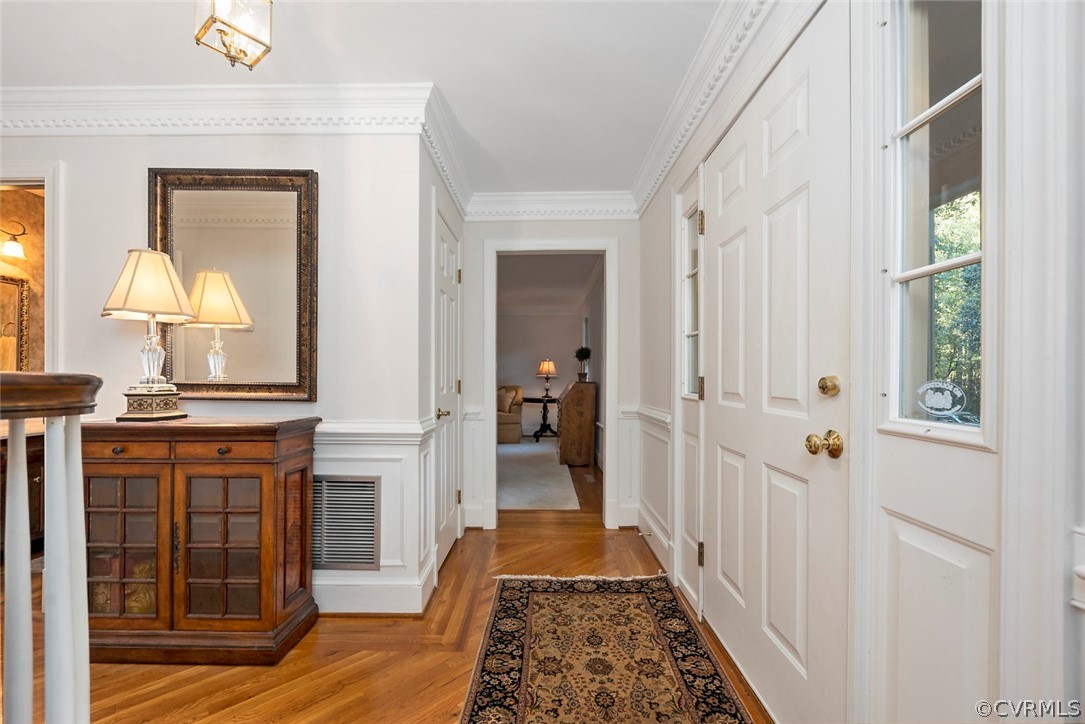 2420 Rochester Court Midlothian, VA 23113 - Photo 4 of 45 a view of a hallway with wooden floor windows and a livingroom