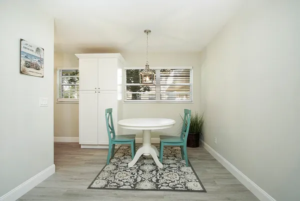 a bathroom with a toilet a sink and a mirror