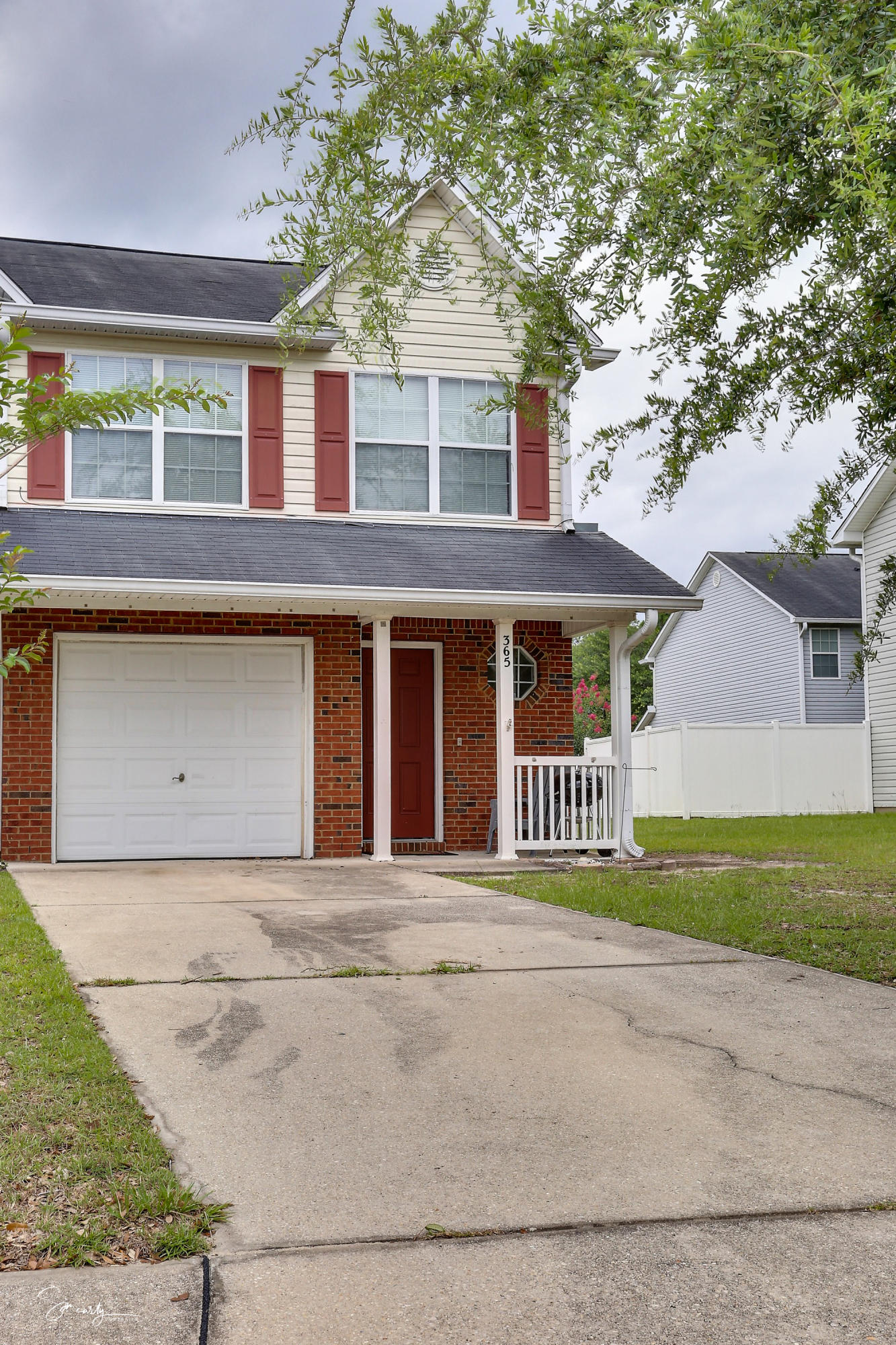 365 Crooked Pine Trail Crestview, FL 32539 - Photo 2 of 35 a front view of a house with a garden