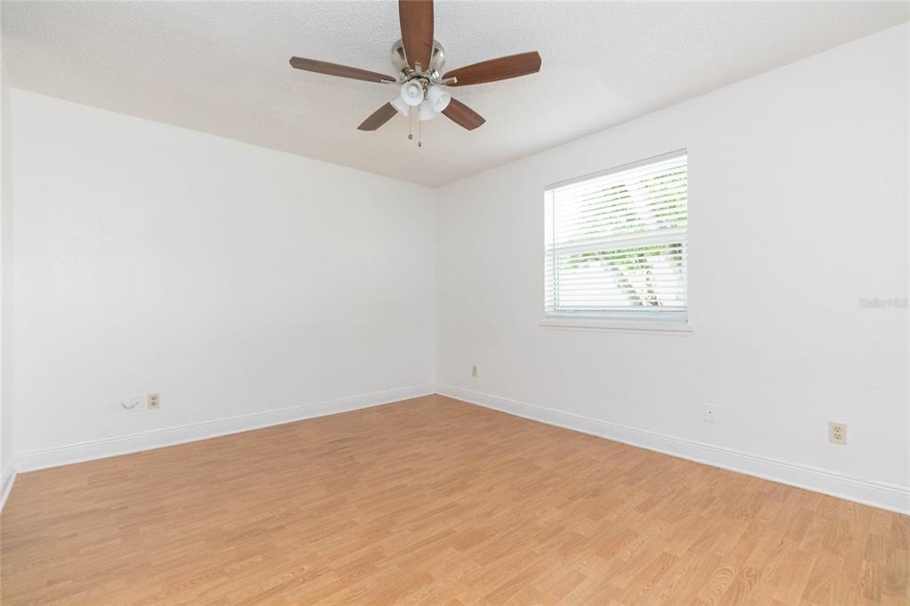 7531 Abonado Road, Unit 1 Tampa, FL 33615 - Photo 12 of 26 an empty room with a window and a fan