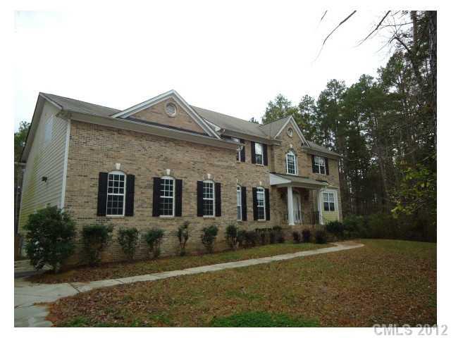 7123 Nesbit Road Waxhaw, NC 28173 - Photo 1 of 16 a front view of a house with a yard