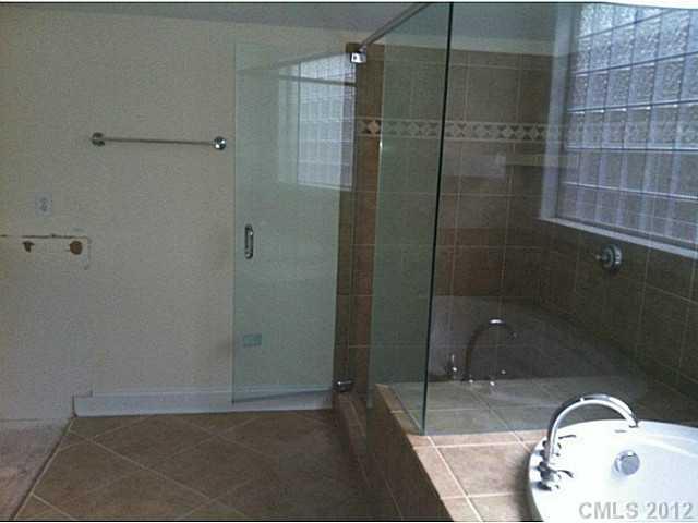 7123 Nesbit Road Waxhaw, NC 28173 - Photo 13 of 16 a bathroom with a shower