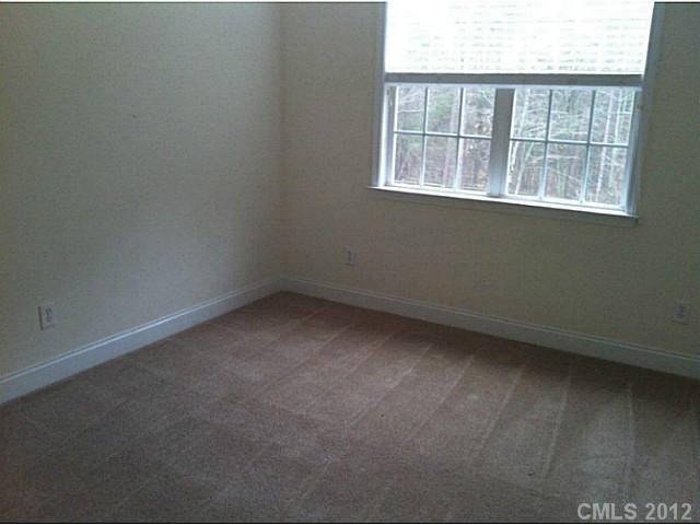 7123 Nesbit Road Waxhaw, NC 28173 - Photo 14 of 16 an empty room with a window