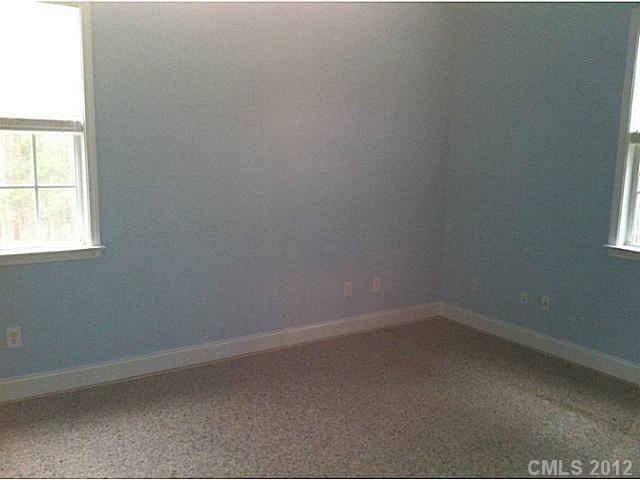 7123 Nesbit Road Waxhaw, NC 28173 - Photo 15 of 16 an empty room with a window