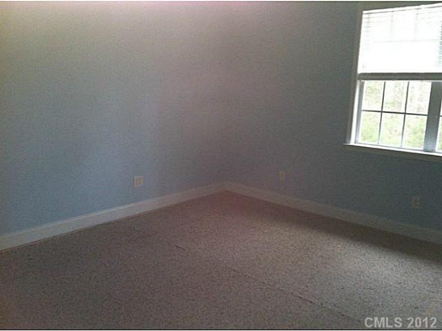 7123 Nesbit Road Waxhaw, NC 28173 - Photo 16 of 16 an empty room with a window