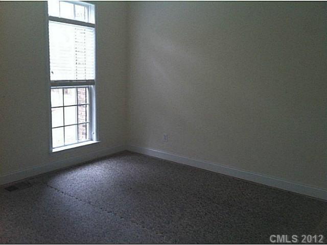 7123 Nesbit Road Waxhaw, NC 28173 - Photo 9 of 16 an empty room with a window