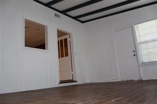 a view of a livingroom with wooden floor