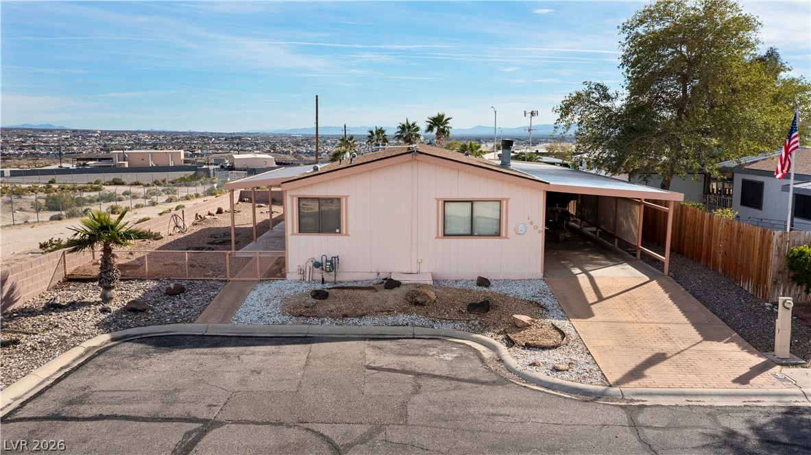 1609 Cajon Court Laughlin, NV 89029 - Photo 54 of 69 View of front of home with an attached carport, driveway, and a mountain view