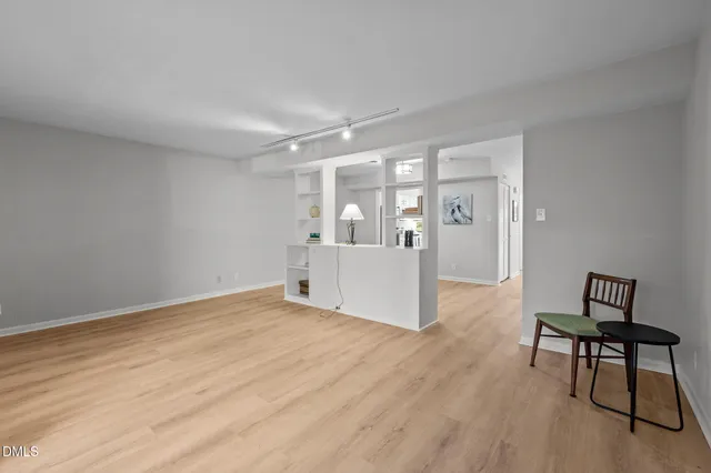 a view of empty room with a fireplace