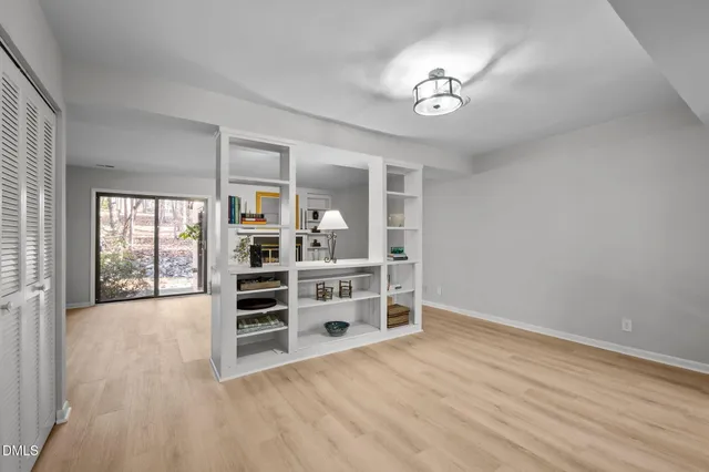 a picture of a bench in front of a wall