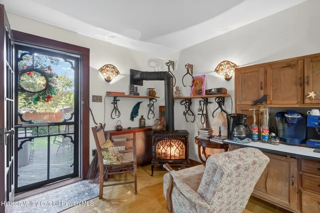 a living room filled with furniture and a floor to ceiling window