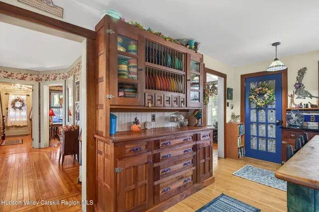 a view of living room with furniture and wooden floor