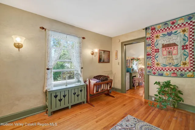 a view of a room with toys and wooden floor