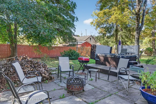 a view of a chairs and table in the patio