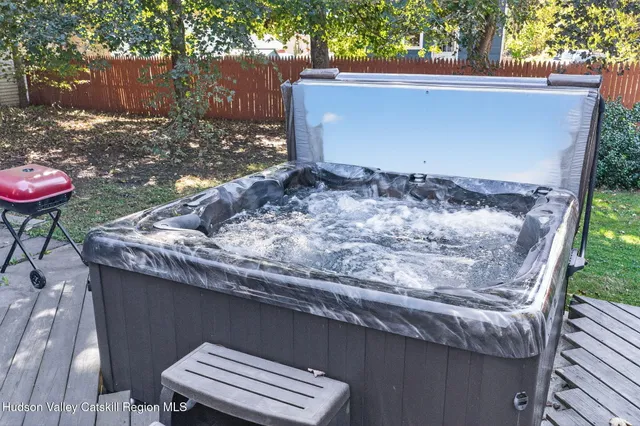 a view of a backyard with a tub