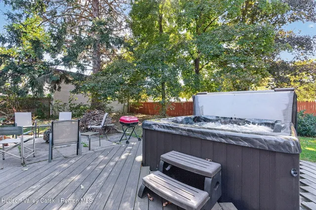 an outdoor sitting area with a table and chairs