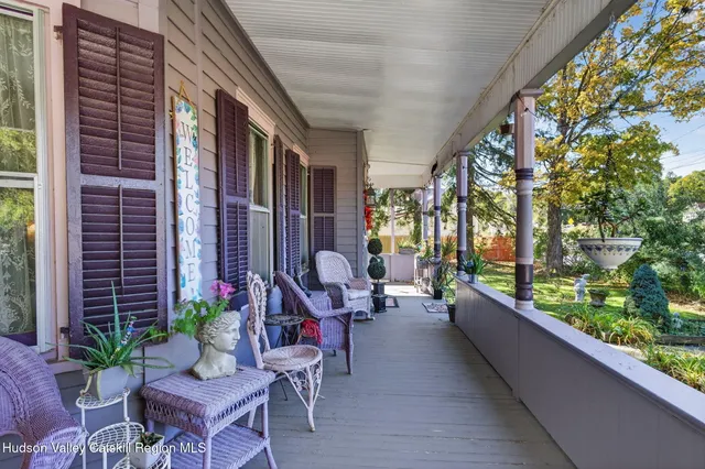 a building outdoor space with patio furniture and potted plants