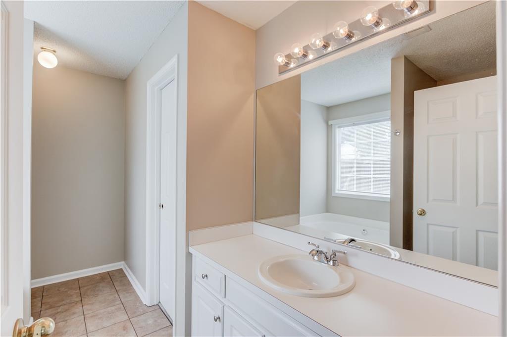 255 Turnberry Lane Winder, GA 30680 - Photo 20 of 41 a bathroom with a sink and a mirror