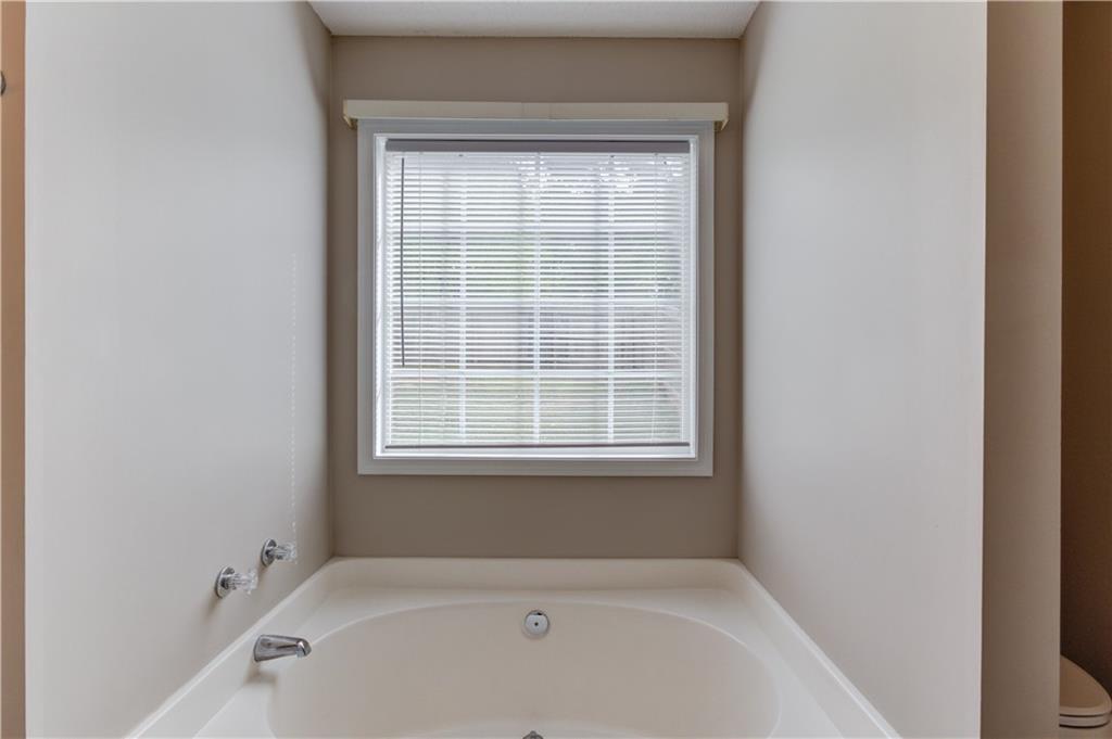 255 Turnberry Lane Winder, GA 30680 - Photo 21 of 41 a white bath tub sitting next to a window