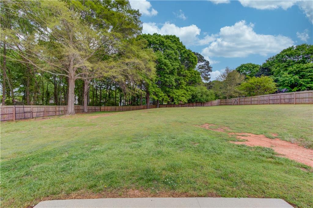 255 Turnberry Lane Winder, GA 30680 - Photo 30 of 41 a backyard of a house with lots of green space