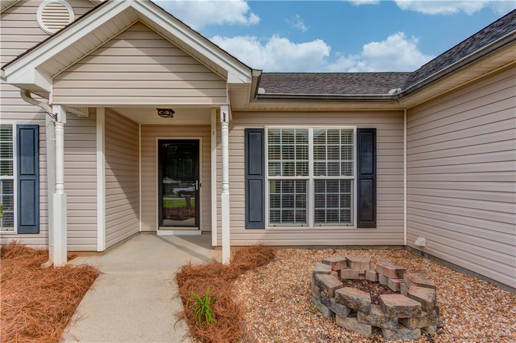 255 Turnberry Lane Winder, GA 30680 - Photo 3 of 41 a view of a house with a door and a window