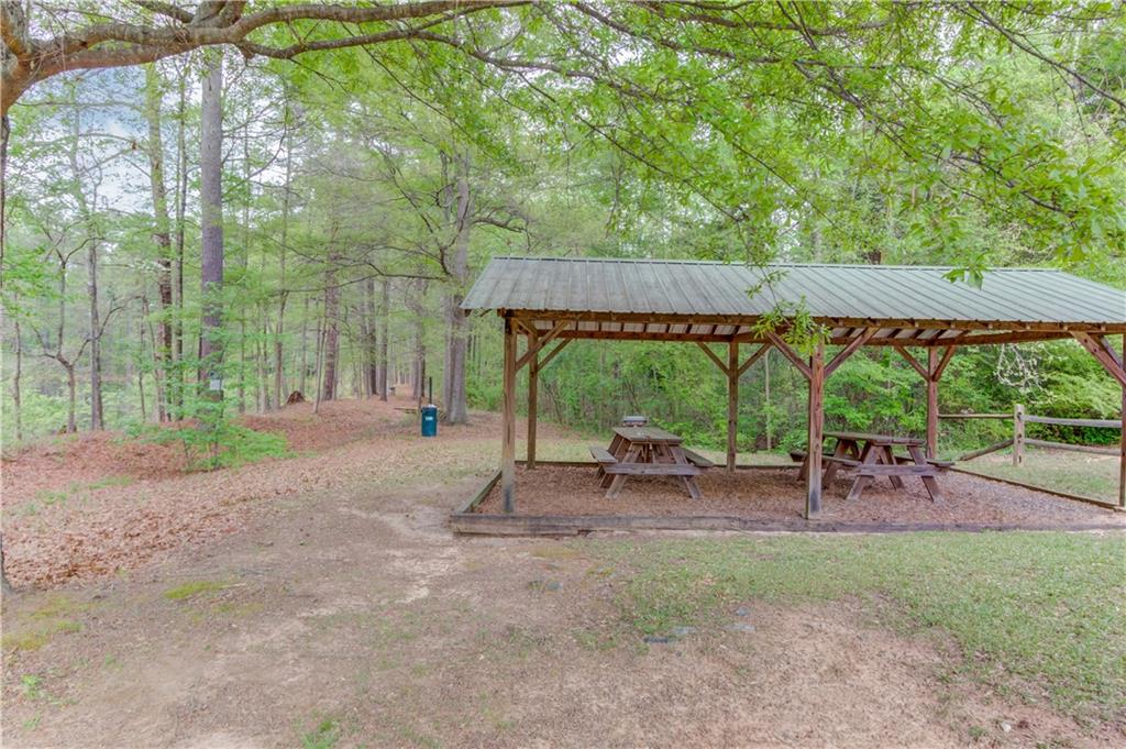 255 Turnberry Lane Winder, GA 30680 - Photo 38 of 41 a backyard of a house with table and chairs