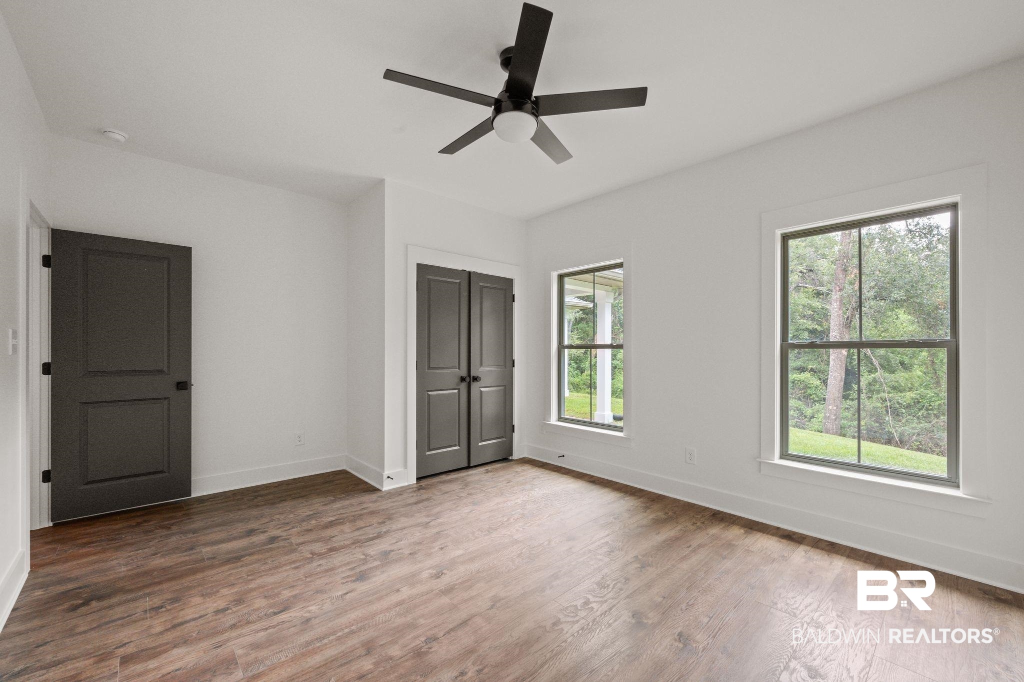 12412 Mannich Lane Foley, AL 36535 - Photo 17 of 23 Spare room with ceiling fan and wood-type flooring
