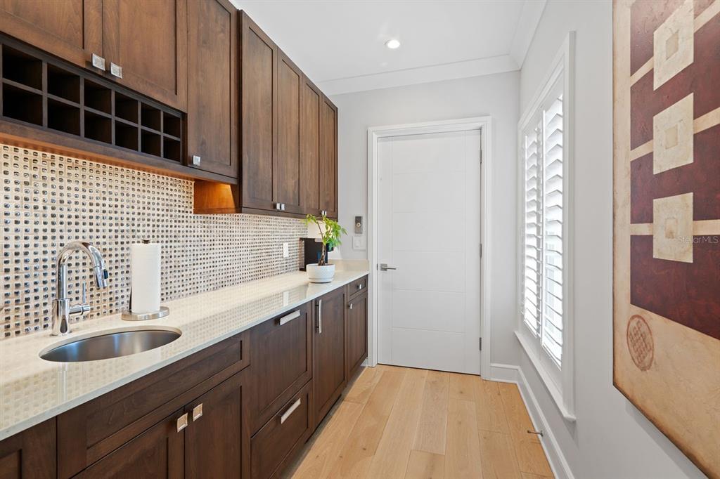 600 Putter Lane Longboat Key, FL 34228 - Photo 22 of 44 a kitchen with a sink stove and cabinets