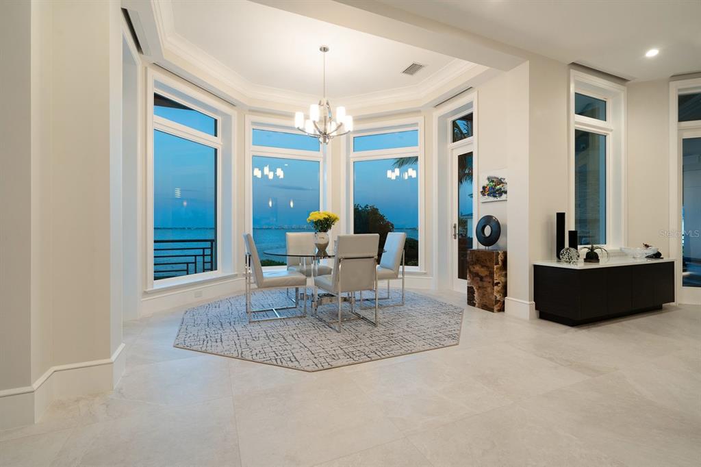 600 Putter Lane Longboat Key, FL 34228 - Photo 36 of 44 a living room with furniture and a large window