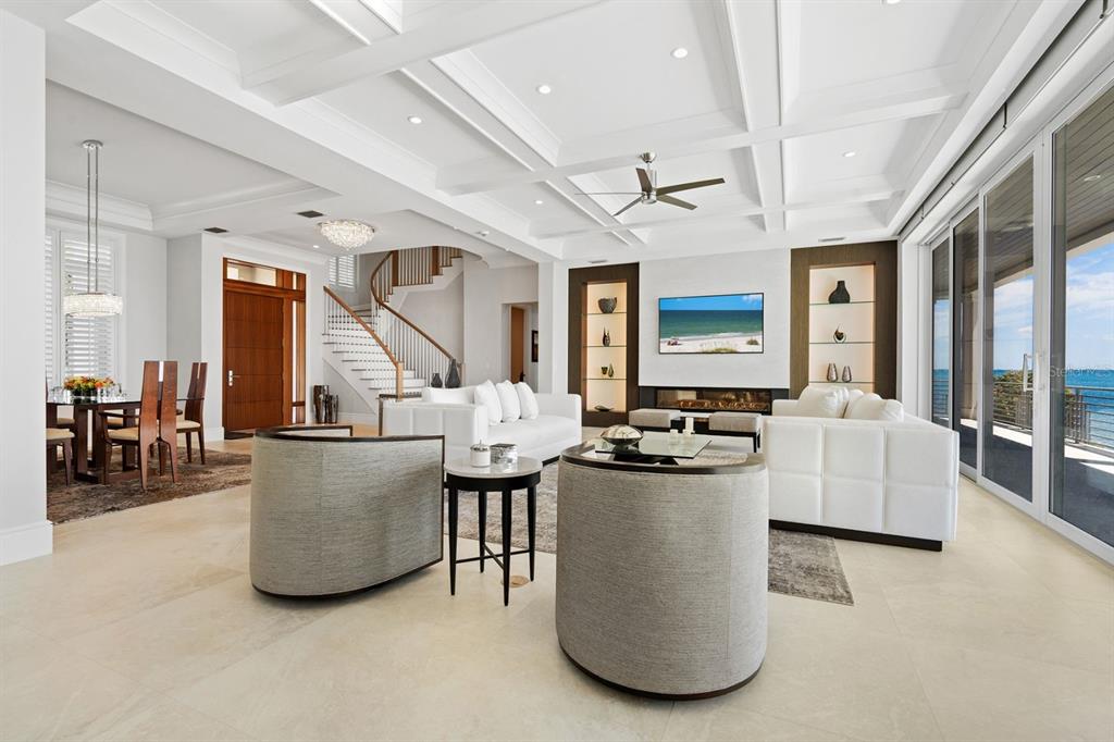 600 Putter Lane Longboat Key, FL 34228 - Photo 4 of 44 a living room with furniture and a flat screen tv