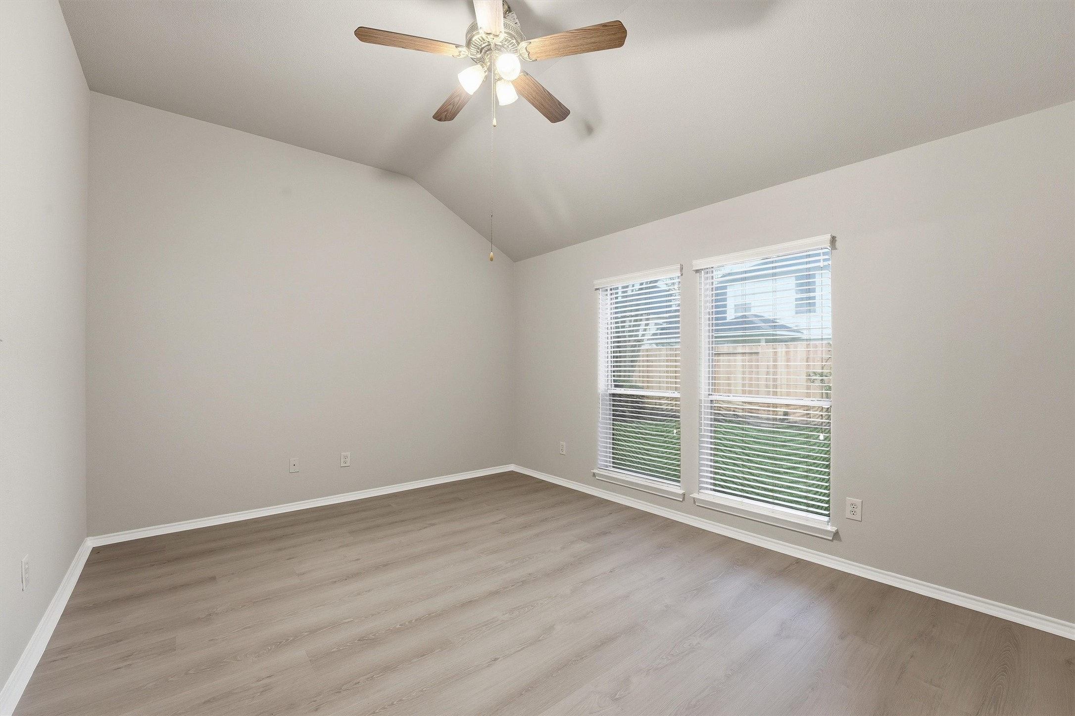 20931 Hamlet Ridge Lane Katy, TX 77449 - Photo 16 of 23 Spacious primary suite with views of backyard and includes a private en suite.