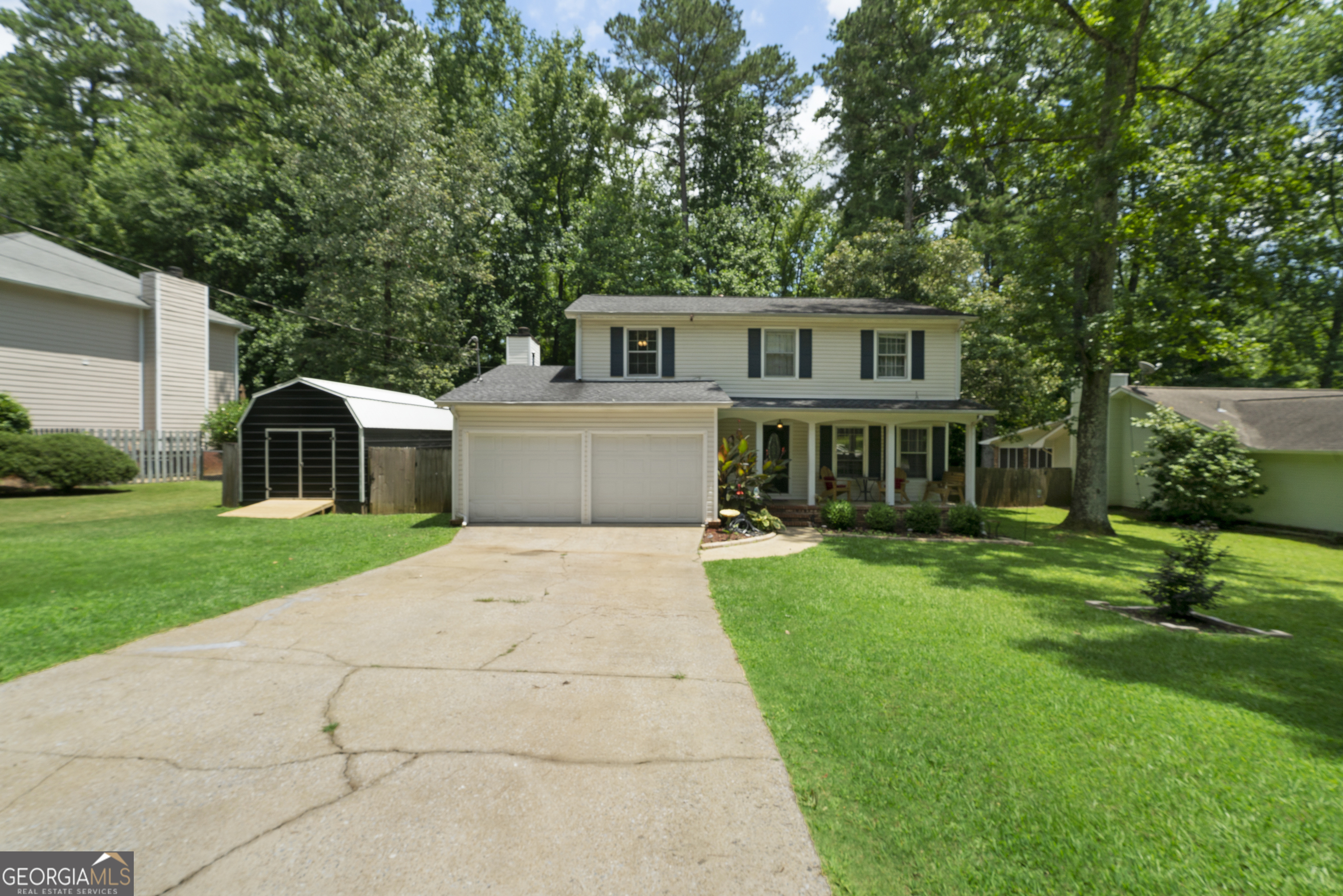 825 Brookhaven Road Anniston, AL 36207 - Photo 1 of 1 a front view of a house with a garden