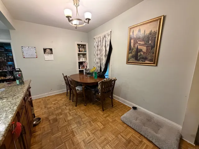 a view of a livingroom with furniture and a chandelier