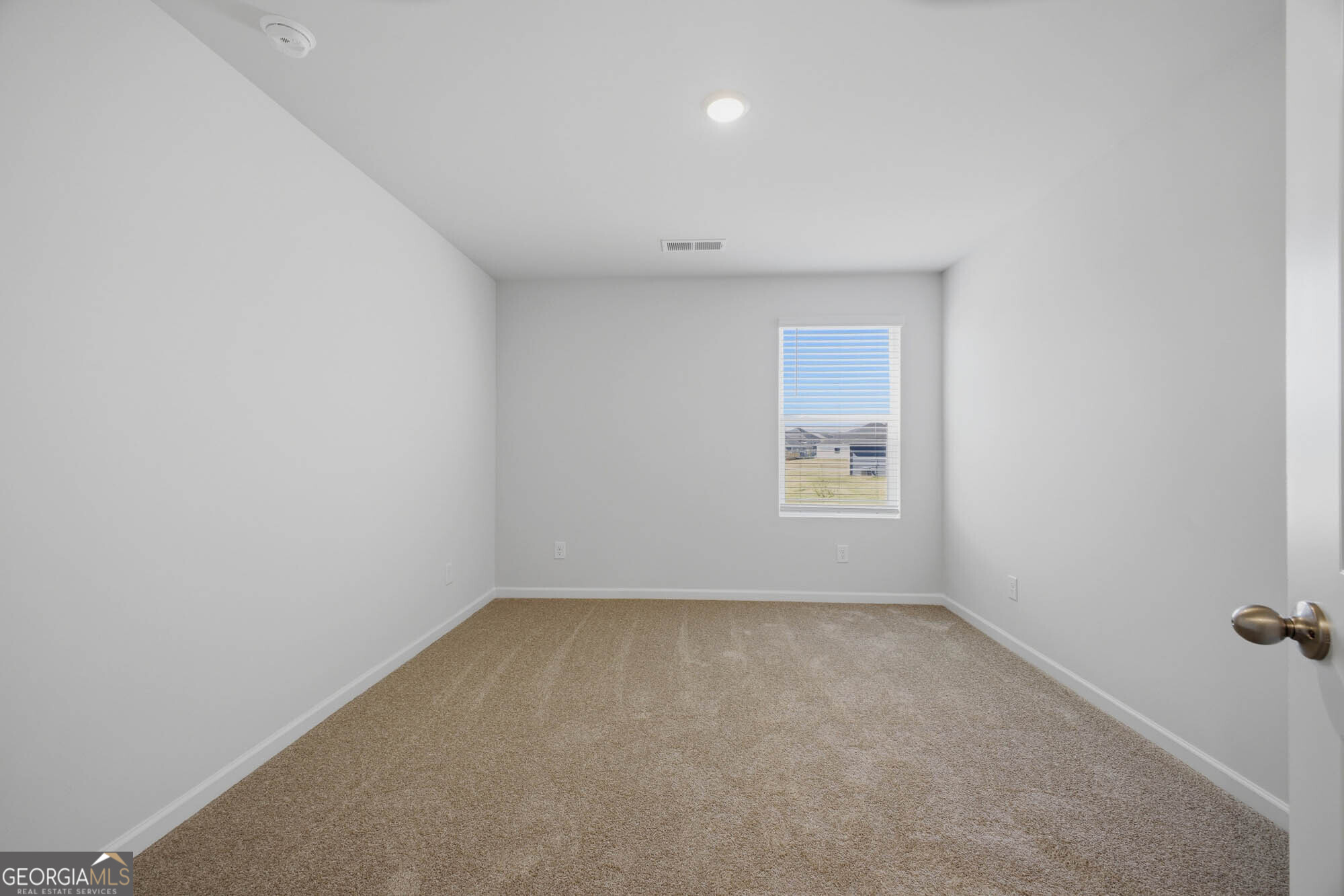 309 Rusty Plow Lane Perry, GA 31069 - Photo 14 of 34 an empty room with a window