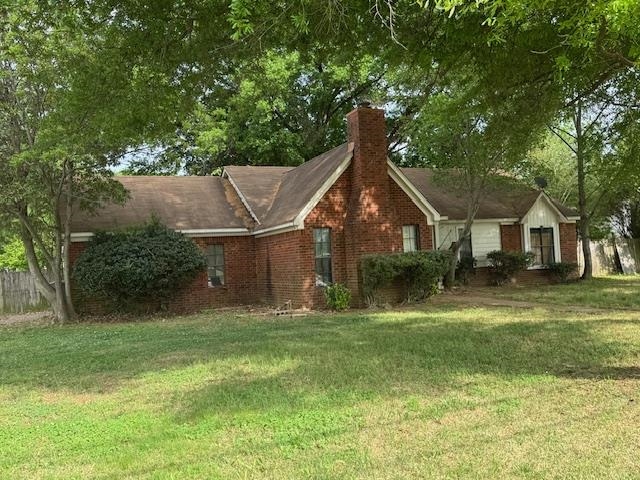 2670 Kate Bond Road Memphis, TN 38133 - Photo 2 of 13 a front view of house with yard and green space