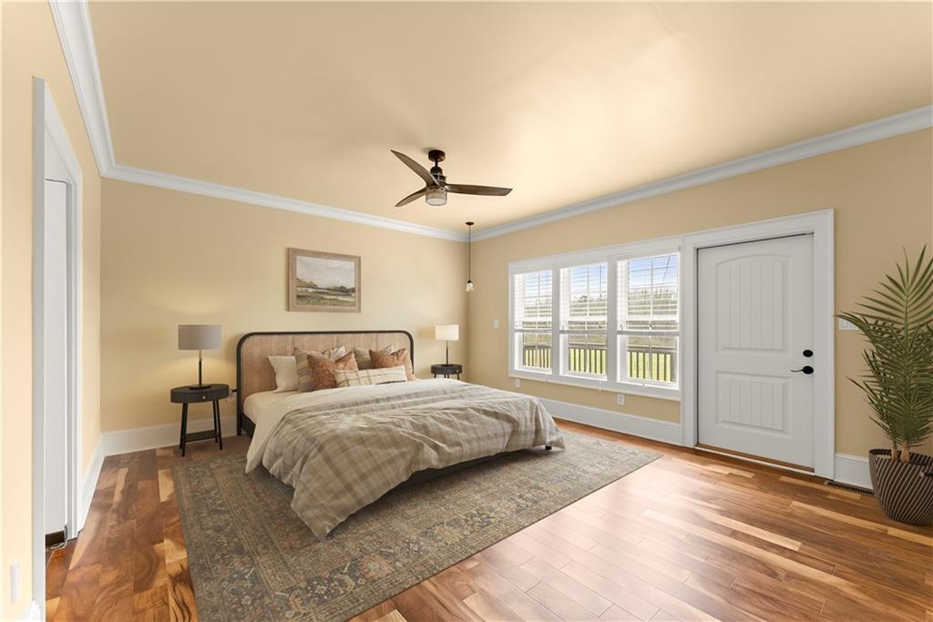 725 County Farm Road Jefferson, GA 30549 - Photo 23 of 66 a bedroom with a large bed and a large window