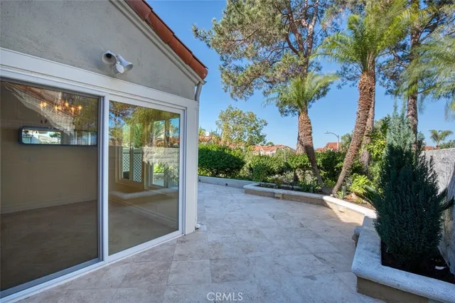 a view of a plants with a fountain in the background