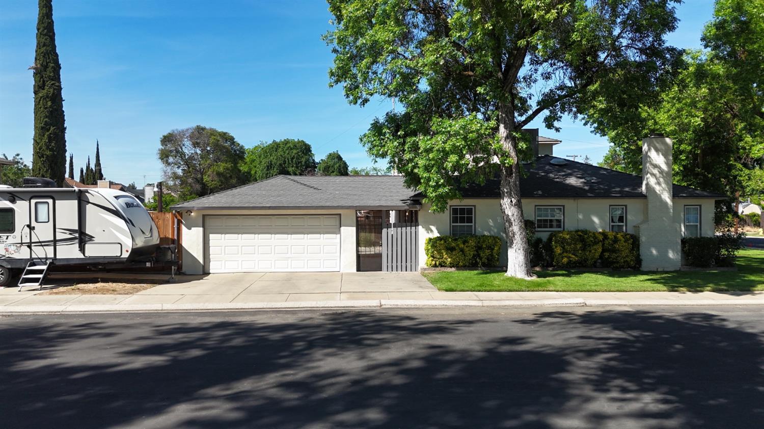 401 Fortuna Avenue Modesto, CA 95354 - Photo 34 of 43 a front view of a house with a yard and garage