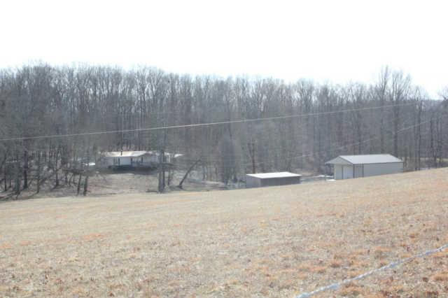 Beautiful land with trees and pasture.  Partially fenced - ready for you to complete.  