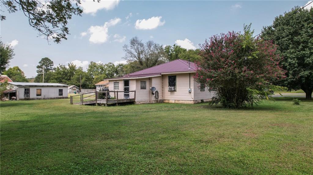 51 West Main Street Kingston, GA 30145 - Photo 8 of 15 a front view of a house with a garden