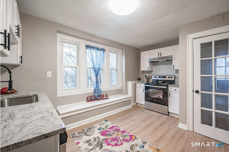 73 Silver Street Middletown, CT 06457 - Photo 12 of 30 a spacious bedroom with a bed and a window