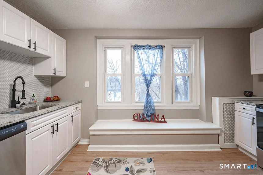 73 Silver Street Middletown, CT 06457 - Photo 13 of 30 a spacious bathroom with a tub sink and mirror