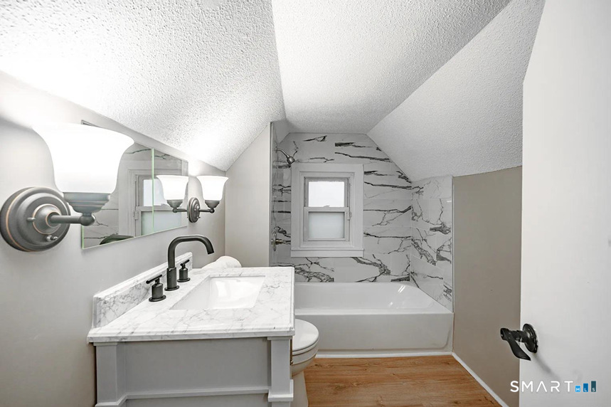 73 Silver Street Middletown, CT 06457 - Photo 24 of 30 a bathroom with a sink and a bathtub