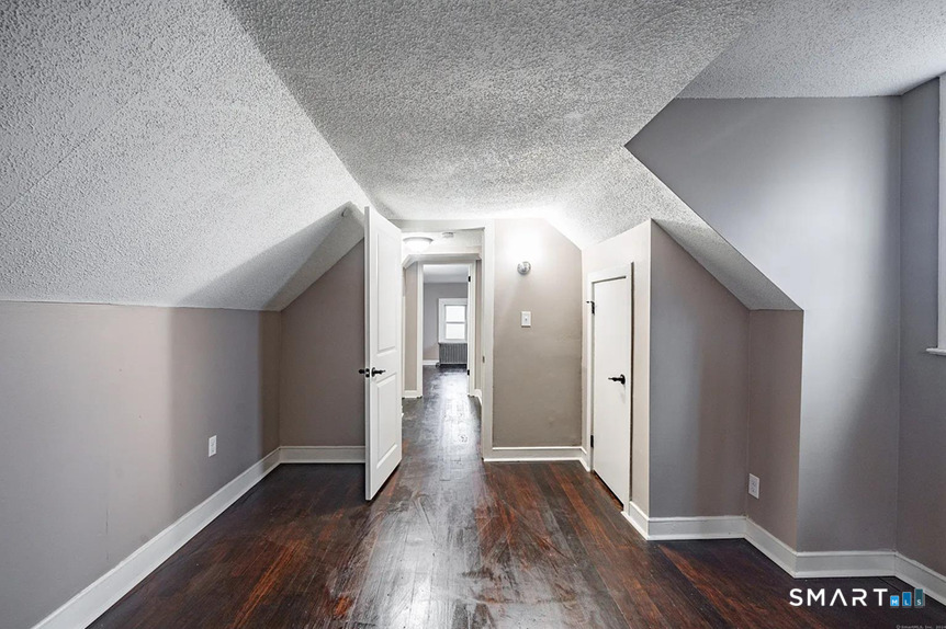 73 Silver Street Middletown, CT 06457 - Photo 26 of 30 a view of a hallway with wooden floor