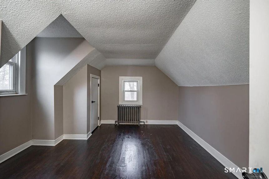 73 Silver Street Middletown, CT 06457 - Photo 27 of 30 a view of a room with wooden floor and a window